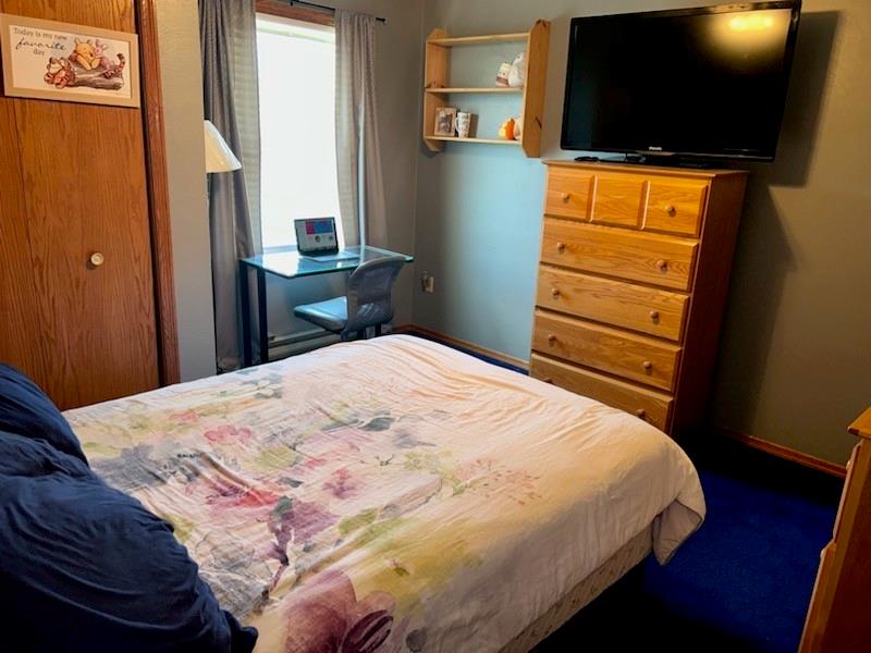 226 Hogback Road Kersey, PA 15846 - Photo 41 of 45 a bedroom with a bed and a flat screen tv