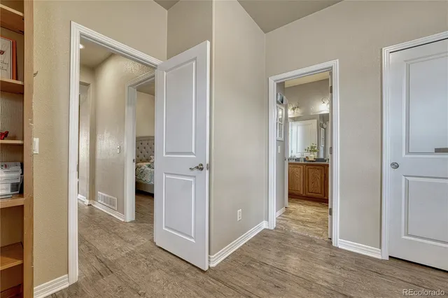 a view of a bathroom from a hallway