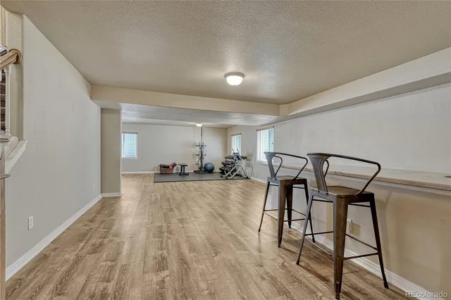 a view of a livingroom with furniture and a ceiling fan