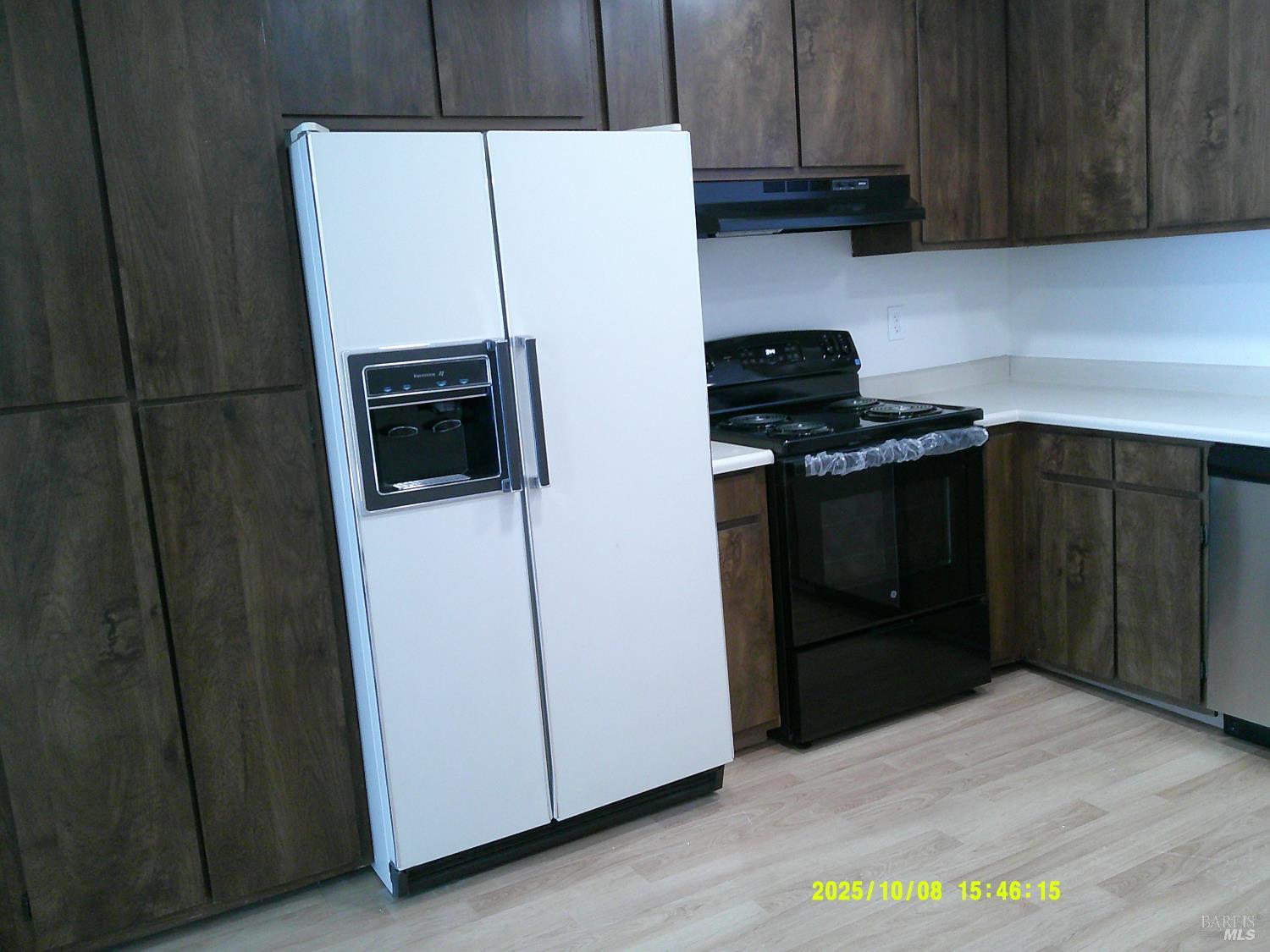 749 Beelard Drive Vacaville, CA 95687 - Photo 2 of 9 a kitchen with a refrigerator sink and cabinets
