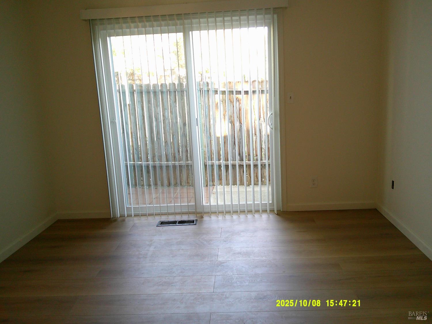 749 Beelard Drive Vacaville, CA 95687 - Photo 6 of 9 an empty room with wooden floor and windows