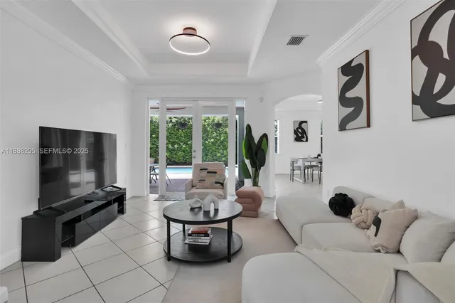 a living room with furniture and a flat screen tv