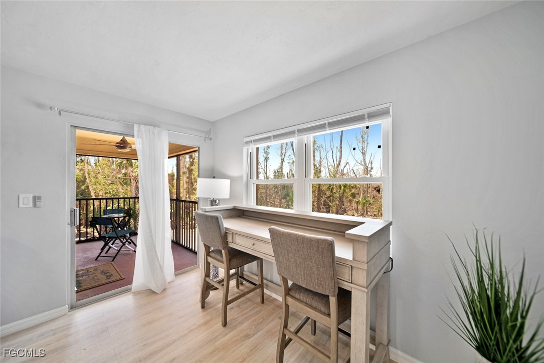 16881 Davis Road, Unit 721 Fort Myers, FL 33908 - Photo 6 of 23 a view of a dining room with furniture window and outside view