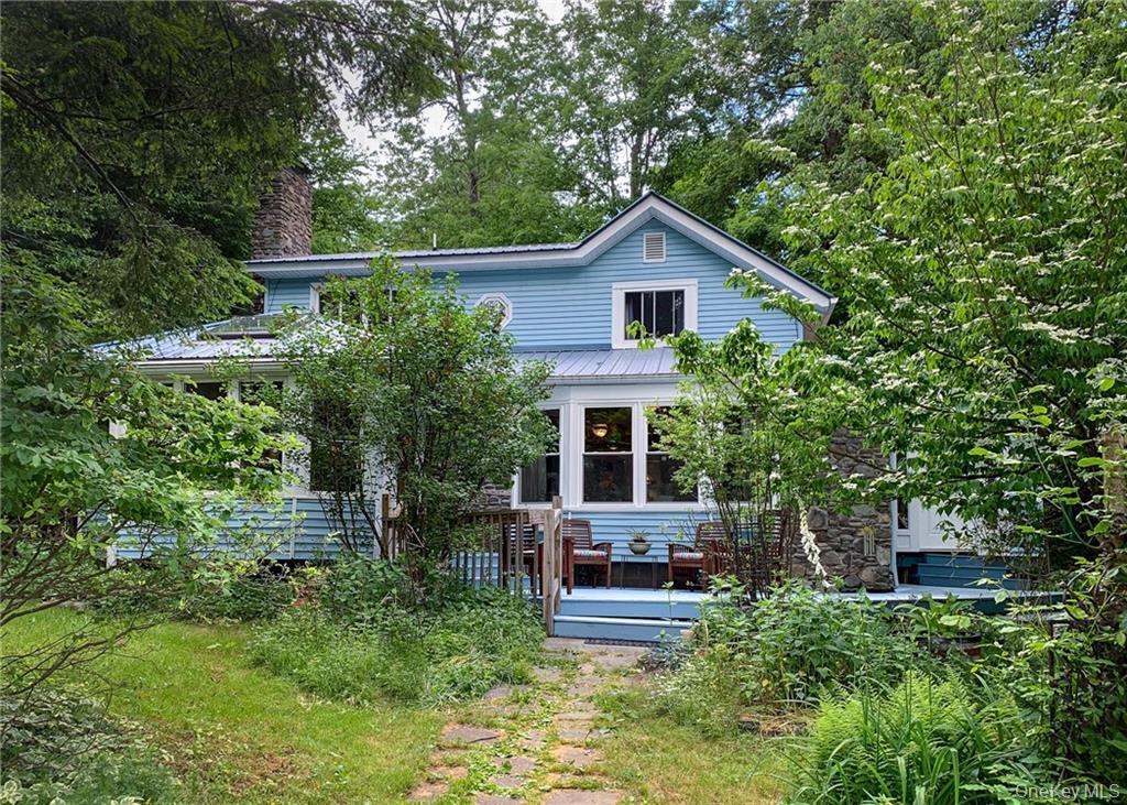 446 Shandelee Road Livingston Manor, NY 12758 - Photo 2 of 32 a backyard of a house with seating space