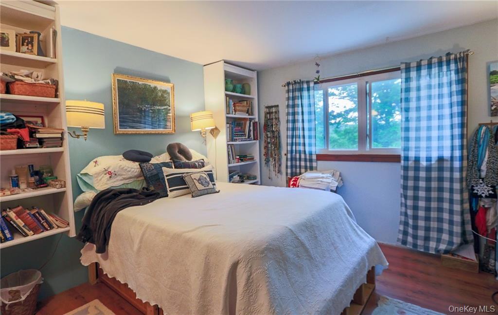 446 Shandelee Road Livingston Manor, NY 12758 - Photo 9 of 32 a bedroom with a bed and a window