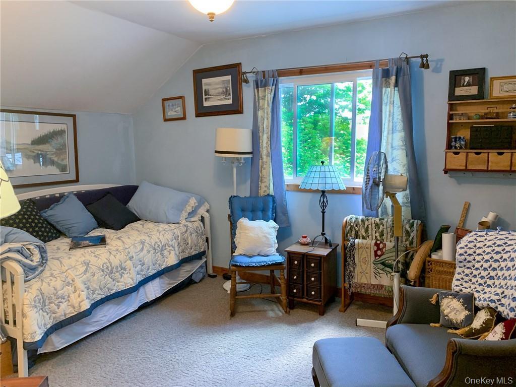 446 Shandelee Road Livingston Manor, NY 12758 - Photo 10 of 32 a bedroom with a bed and a couch