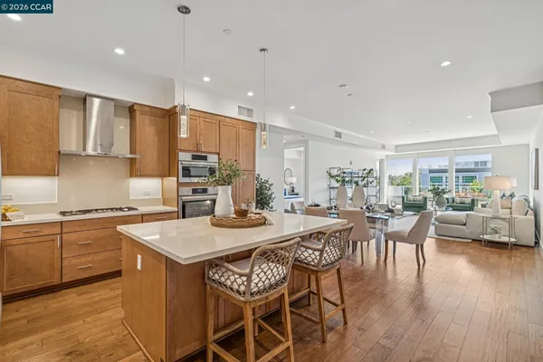 a large kitchen with a table and chairs