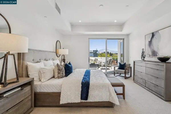 a living room with furniture a flat screen tv and a dresser