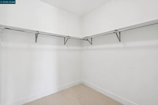 a bed room with a bed and a chair