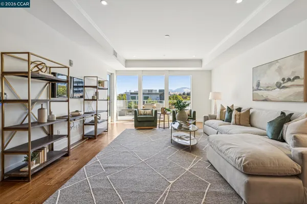 a living room with furniture cabinets and window