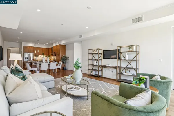 a living room with furniture and white walls