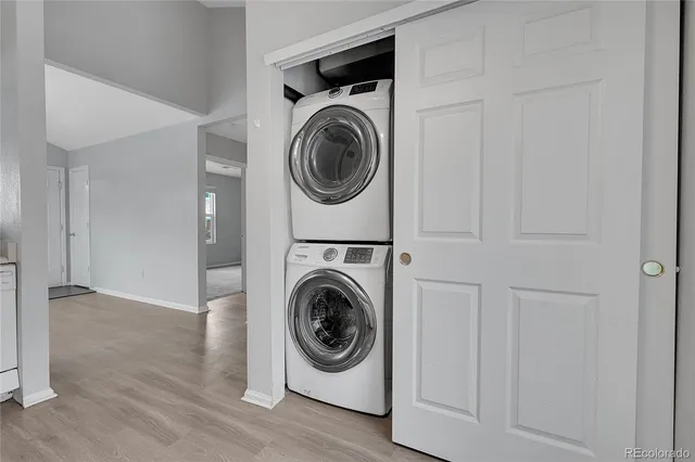 a utility room with sink dryer and washer