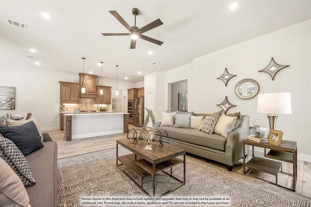 1148 Hitching Post Way Oak Point, TX 75068 - Photo 12 of 31 a living room with furniture and kitchen view
