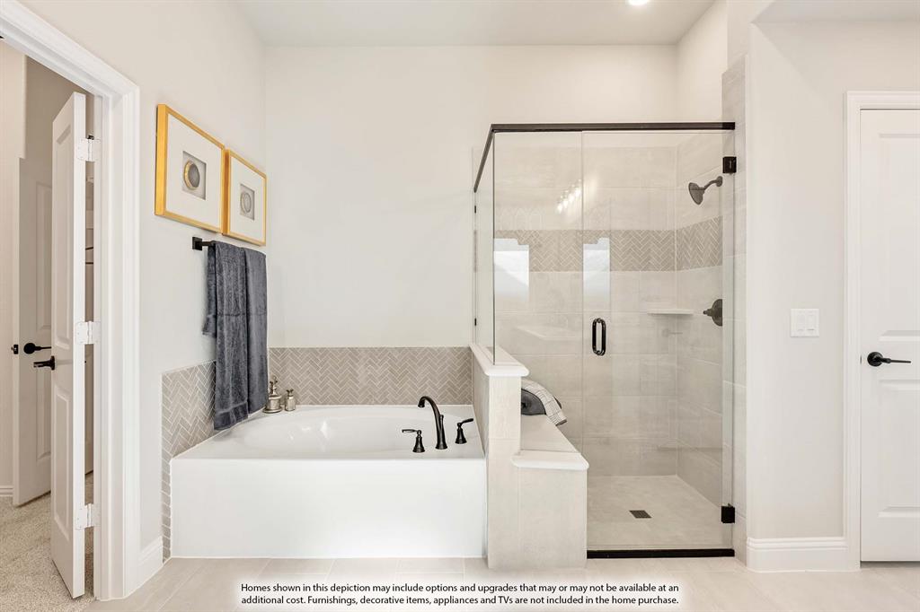 1148 Hitching Post Way Oak Point, TX 75068 - Photo 28 of 31 a bathroom with a bathtub and a shower