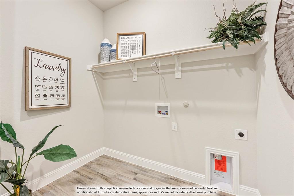 1148 Hitching Post Way Oak Point, TX 75068 - Photo 29 of 31 a view of a door and chair in a room