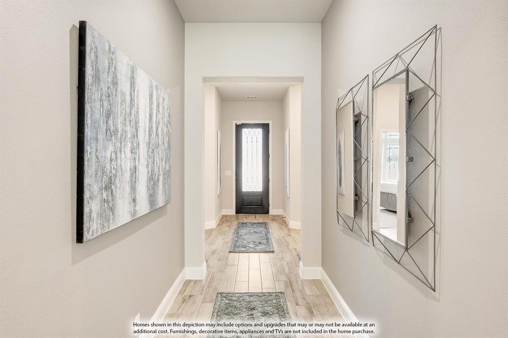 1148 Hitching Post Way Oak Point, TX 75068 - Photo 3 of 31 a view of a hallway with windows