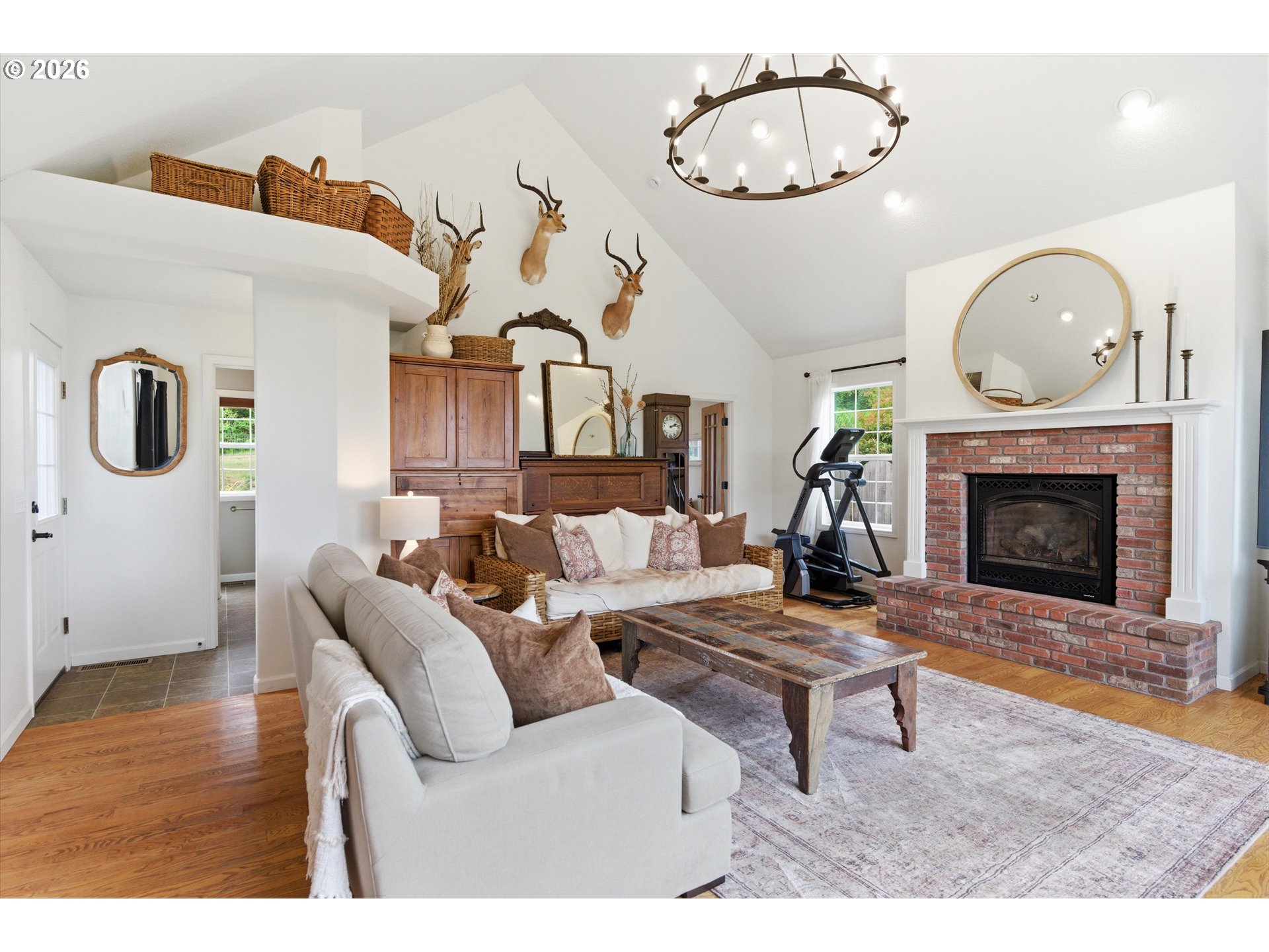 13880 McCaleb Road Monmouth, OR 97361 - Photo 20 of 44 a living room with furniture a clock and a fireplace