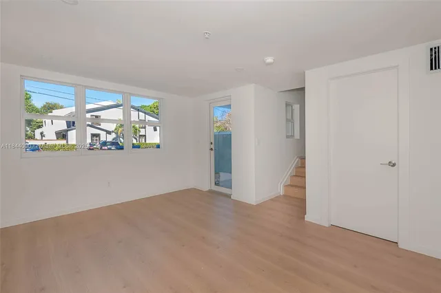 a view of an empty room with a window