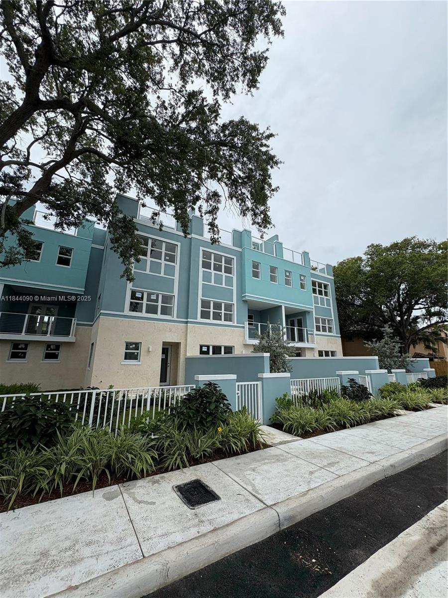 824 Southeast 12th Court, Unit 1 Fort Lauderdale, FL 33316 - Photo 3 of 21 a front view of a house with a garden