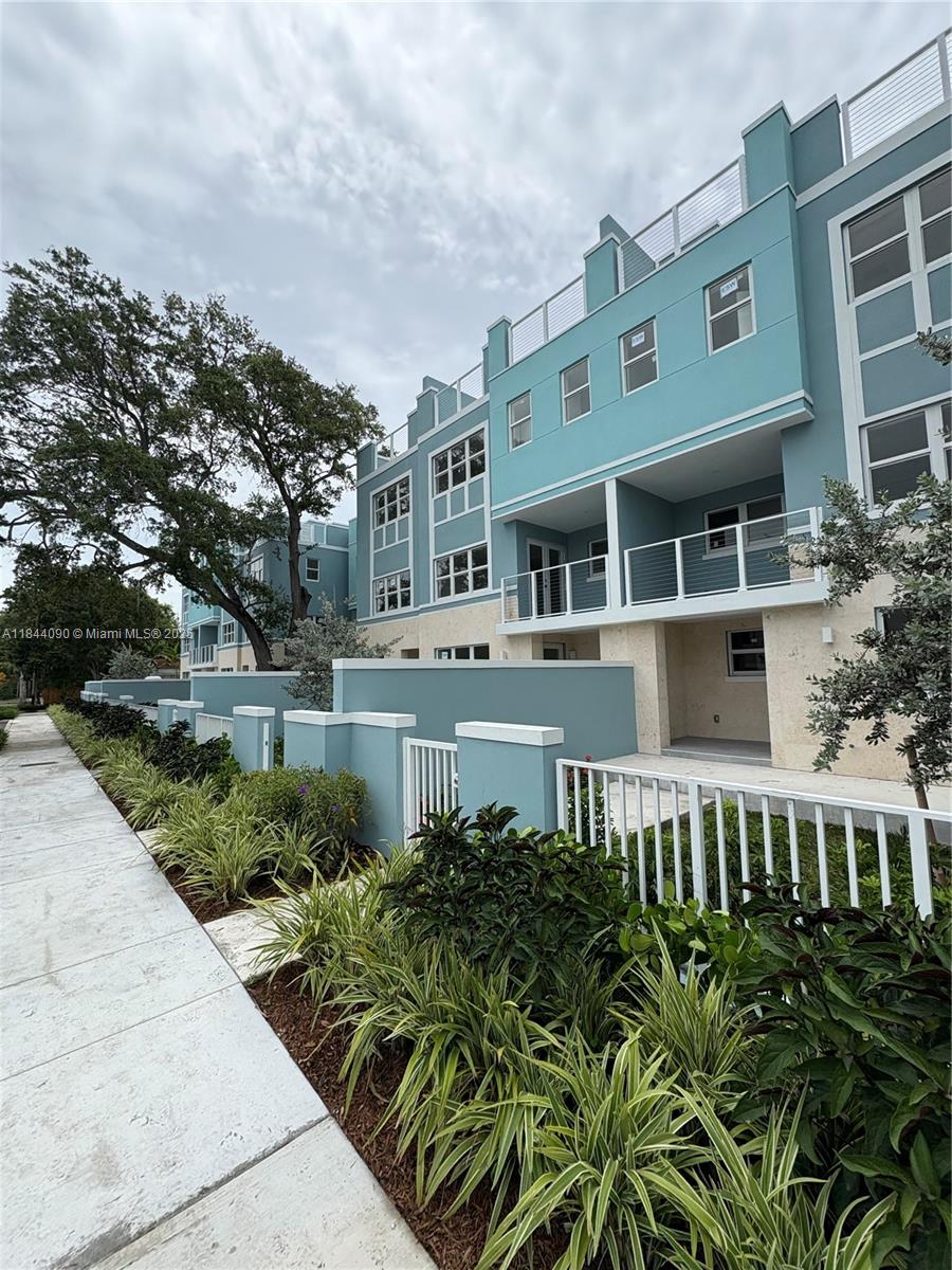 824 Southeast 12th Court, Unit 1 Fort Lauderdale, FL 33316 - Photo 5 of 21 a front view of a house with a yard