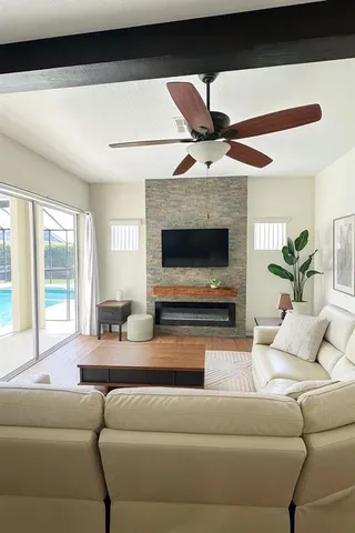 a living room with furniture and a fireplace