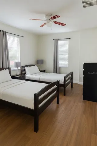 a bedroom with furniture and a window