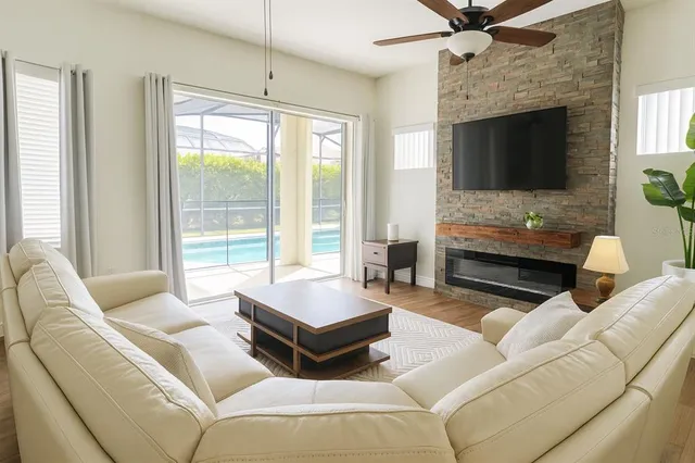 a living room with furniture and a fireplace