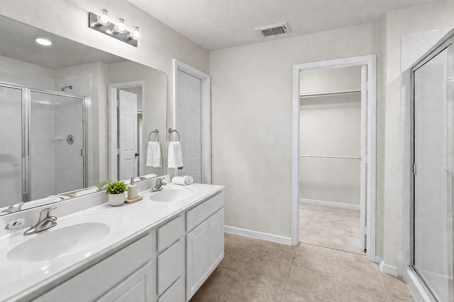 3522 Brackenfern Road Katy, TX 77449 - Photo 15 of 17 a bathroom with a double vanity sink and a mirror