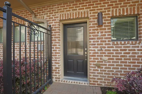 a brick building with a window and door