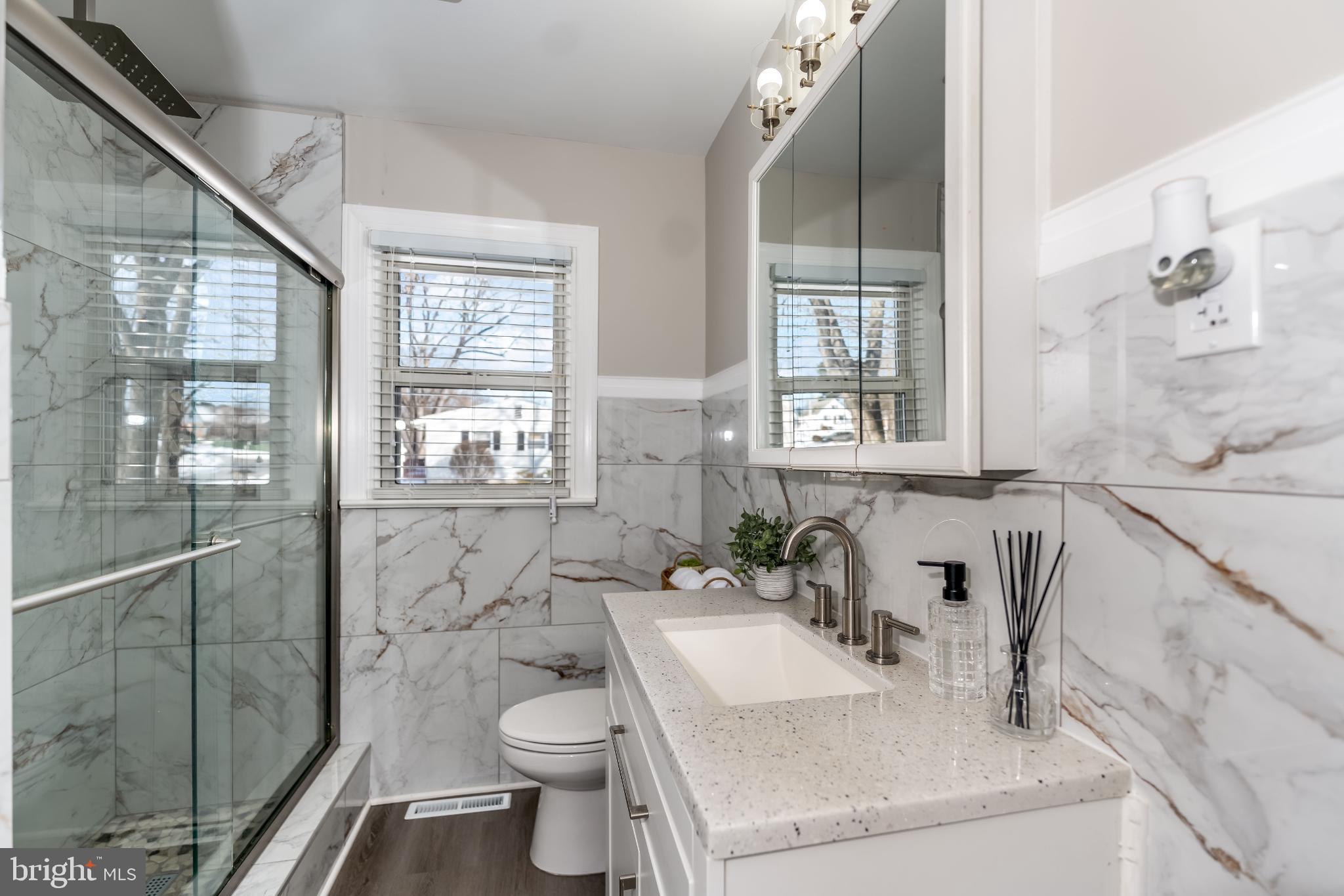 106 Rutherford Road Harrisburg, PA 17109 - Photo 11 of 27 a bathroom with a sink toilet and shower