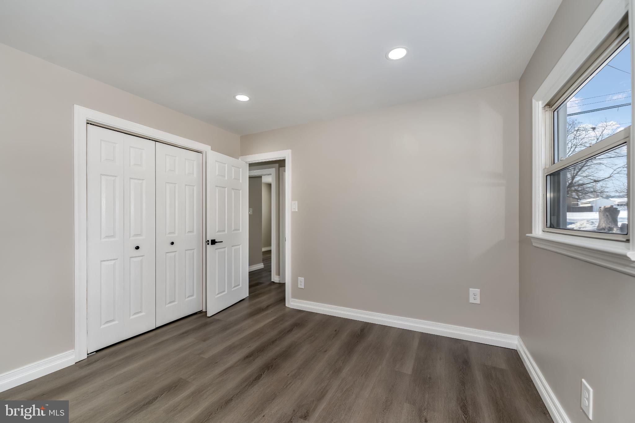 106 Rutherford Road Harrisburg, PA 17109 - Photo 15 of 27 a view of an empty room with wooden floor and a window