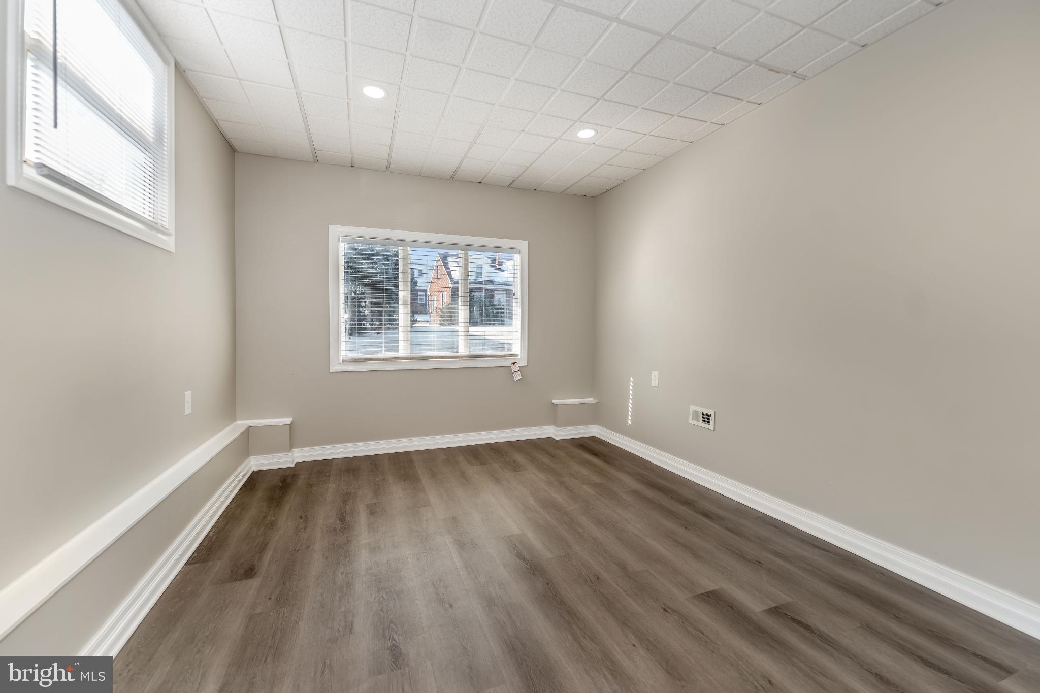 106 Rutherford Road Harrisburg, PA 17109 - Photo 20 of 27 an empty room with wooden floor and windows