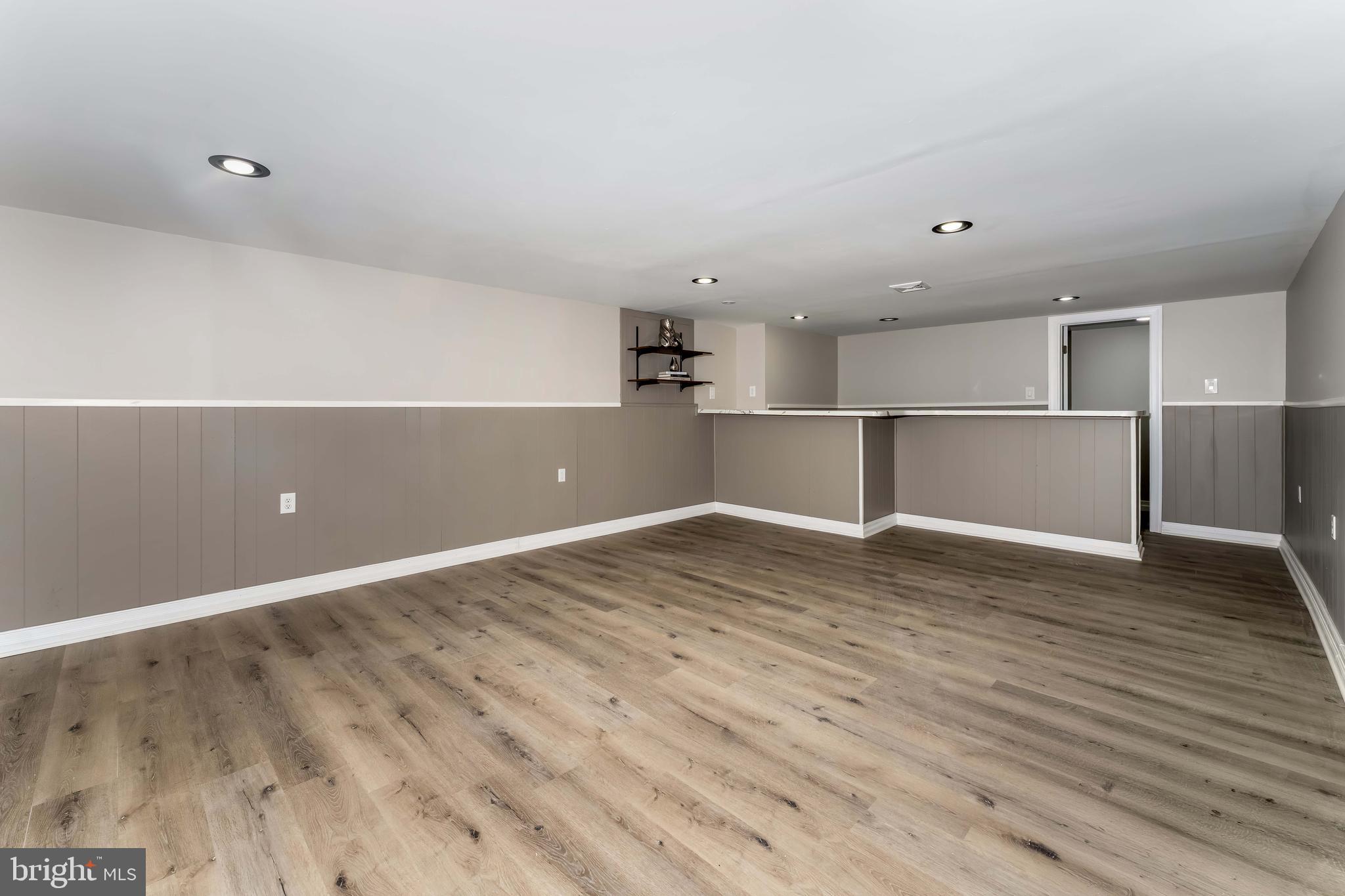 106 Rutherford Road Harrisburg, PA 17109 - Photo 22 of 27 a view of a kitchen with a fridge and wooden floor