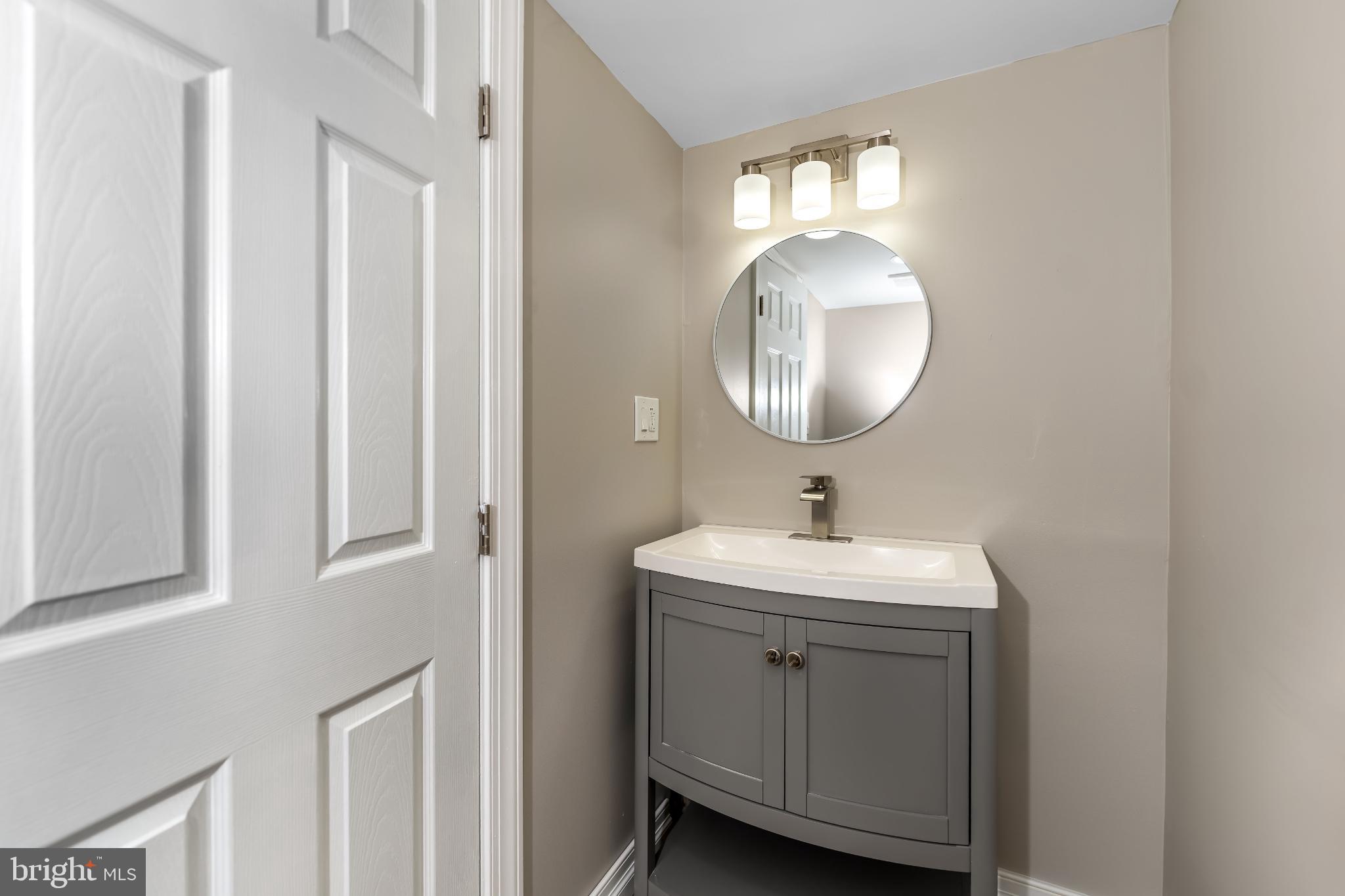 106 Rutherford Road Harrisburg, PA 17109 - Photo 24 of 27 a bathroom with a sink and a mirror