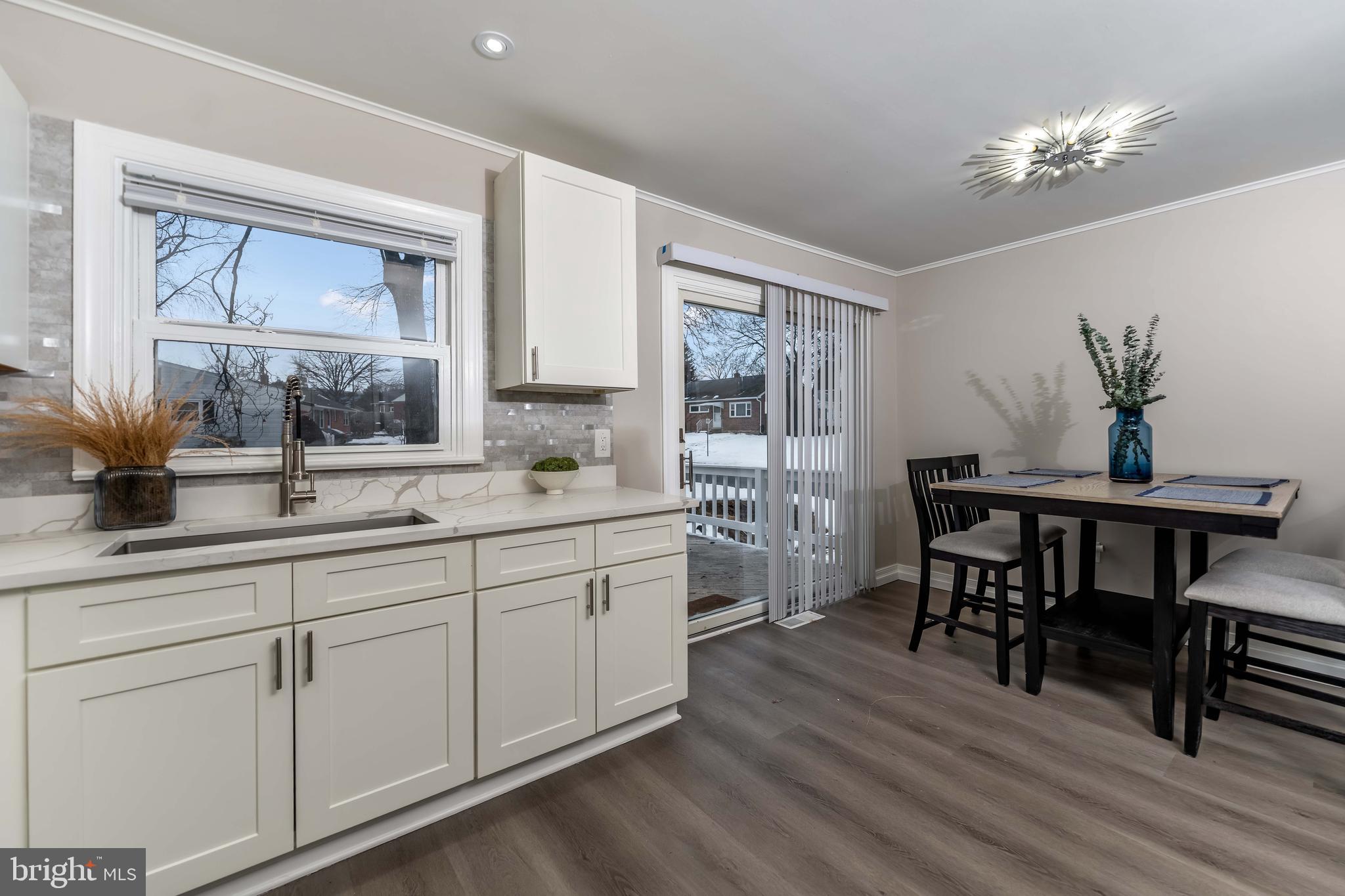 106 Rutherford Road Harrisburg, PA 17109 - Photo 4 of 27 a kitchen with sink dining table and chairs
