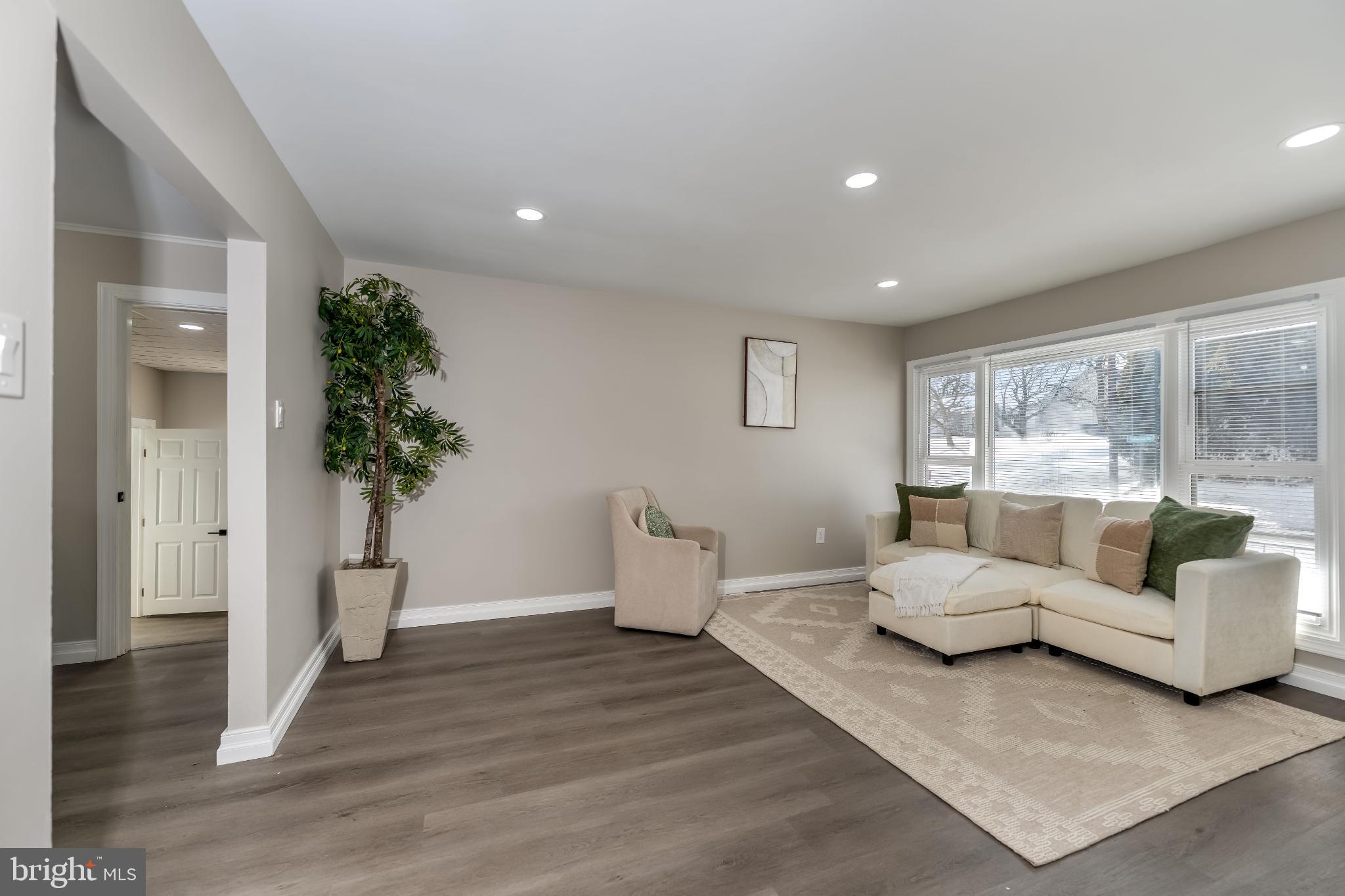 106 Rutherford Road Harrisburg, PA 17109 - Photo 9 of 27 a living room with furniture and a large window