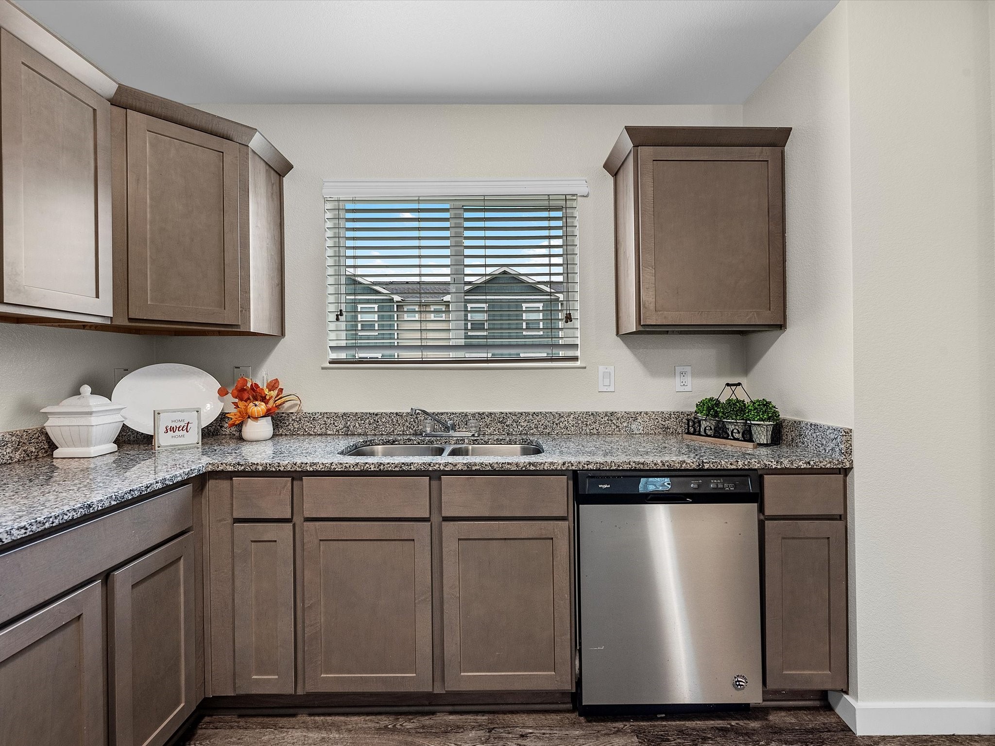 21155 Gosling Road, Unit 31B Spring, TX 77388 - Photo 5 of 36 a kitchen with granite countertop a sink and a stove