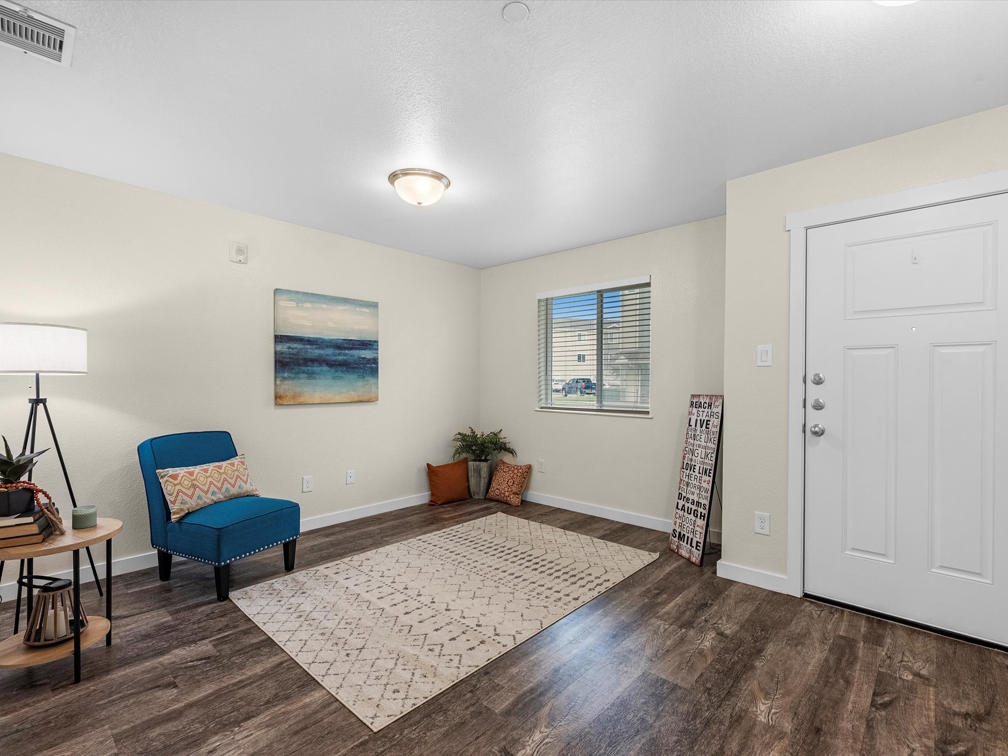 21155 Gosling Road, Unit 31B Spring, TX 77388 - Photo 7 of 36 a living room with furniture and a wooden floor