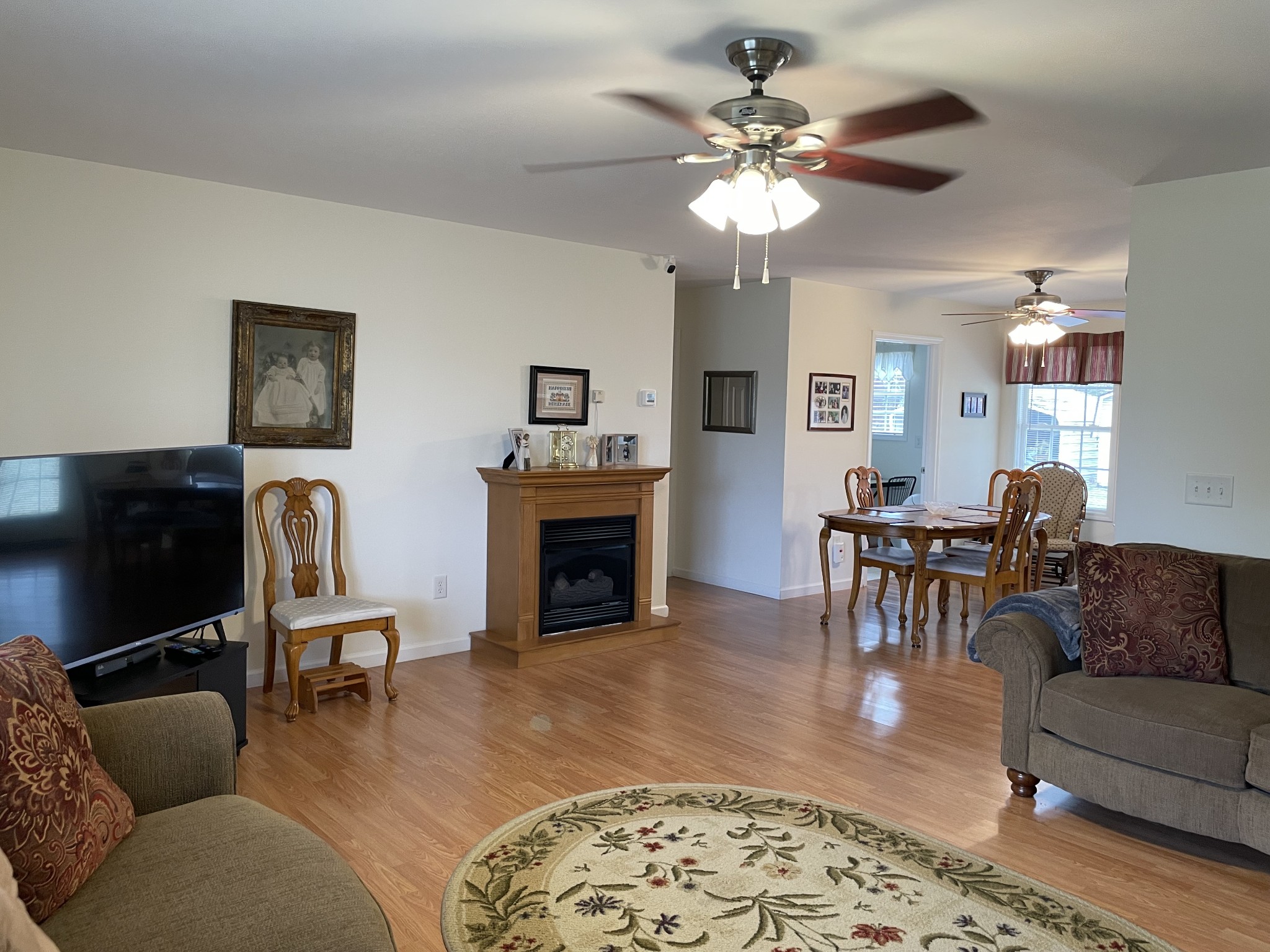 301 Rosson Street Summertown, TN 38483 - Photo 13 of 29 a living room with furniture a fireplace and a flat screen tv