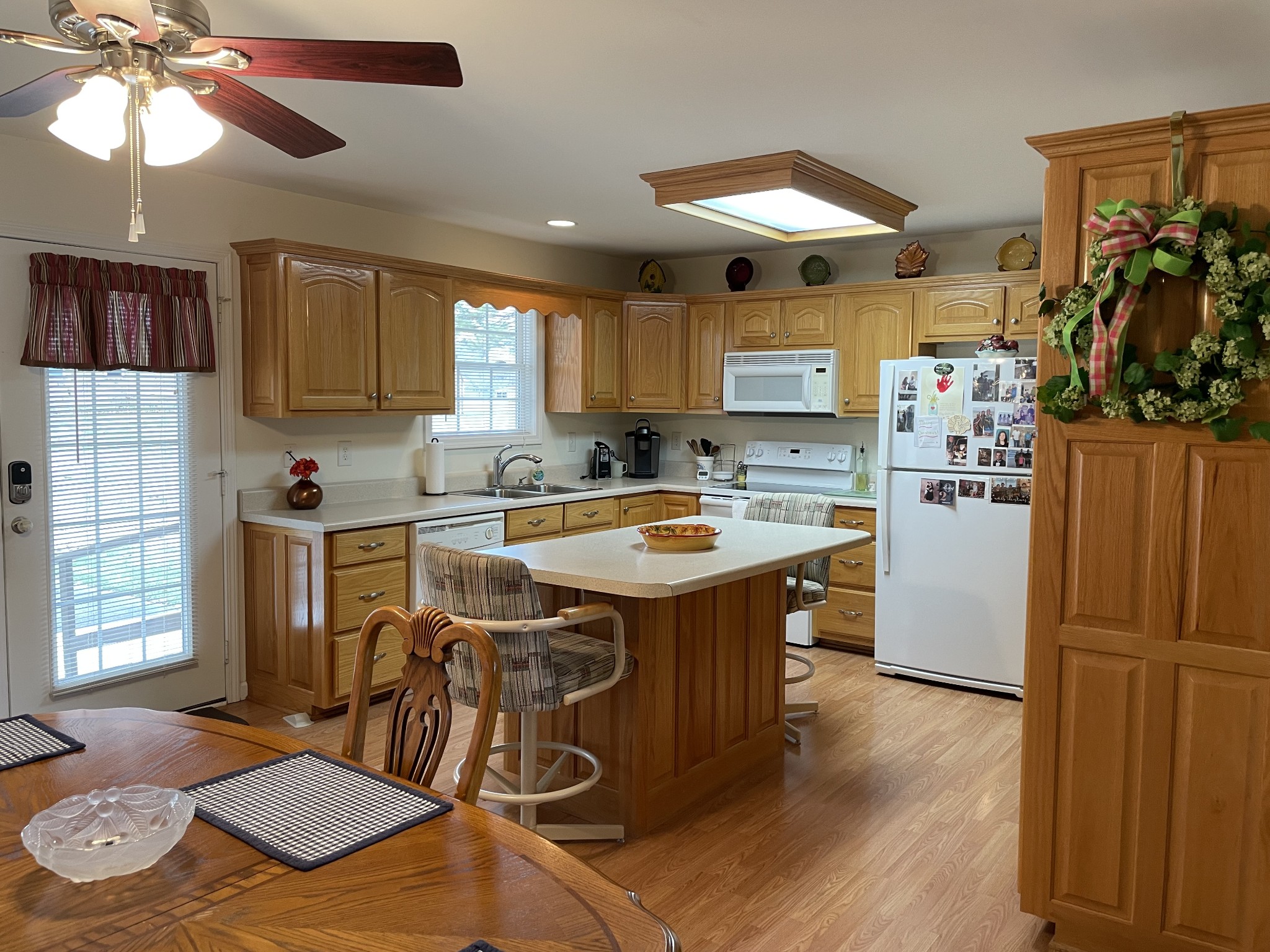 301 Rosson Street Summertown, TN 38483 - Photo 14 of 29 a kitchen with stainless steel appliances granite countertop a sink stove and refrigerator