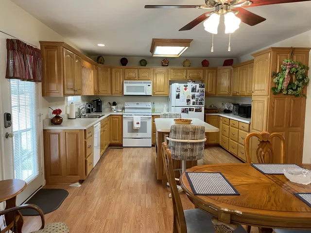 a bathroom with a granite countertop shower and a toilet