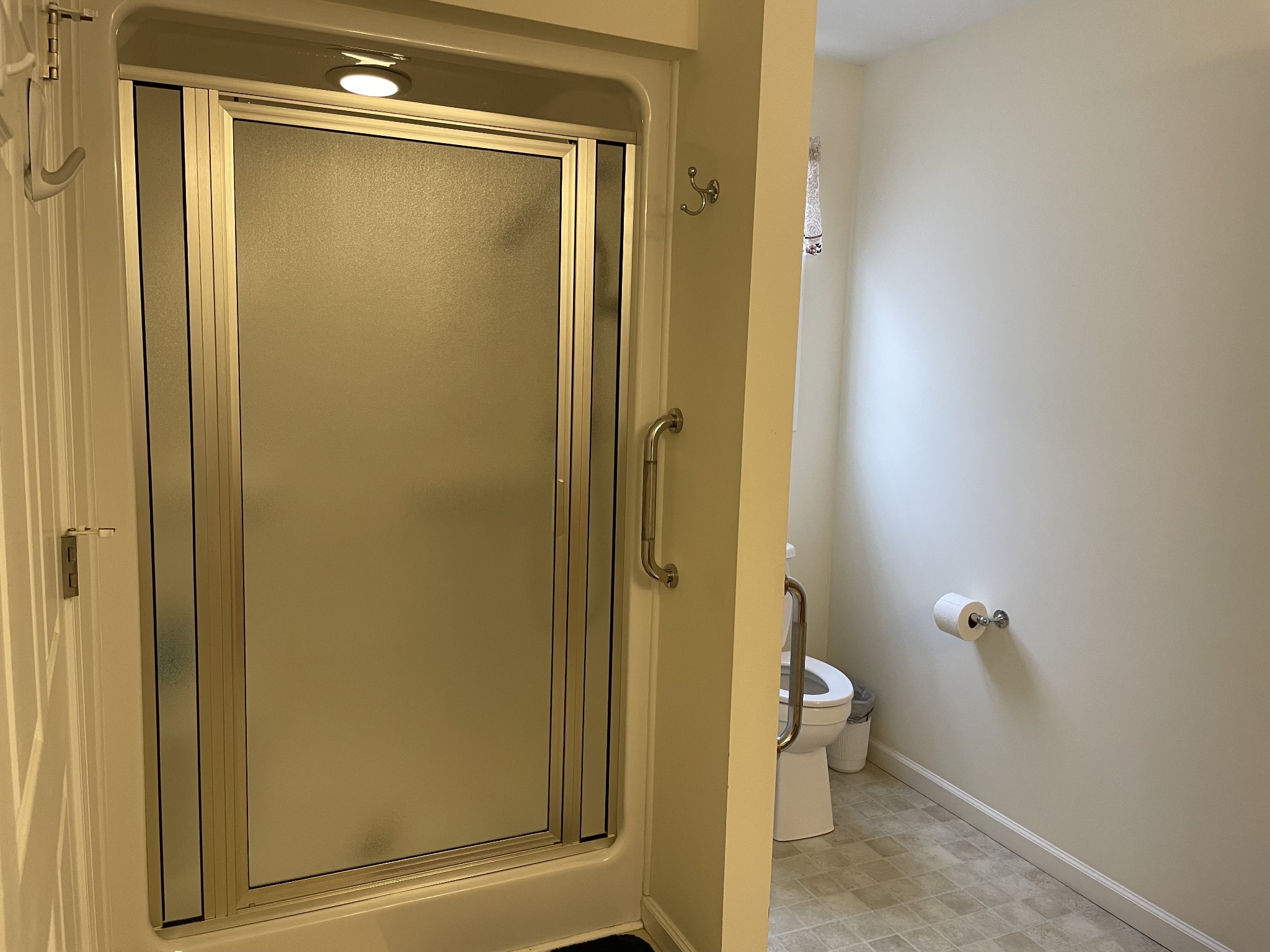 301 Rosson Street Summertown, TN 38483 - Photo 21 of 29 a bathroom with a granite countertop shower and a toilet