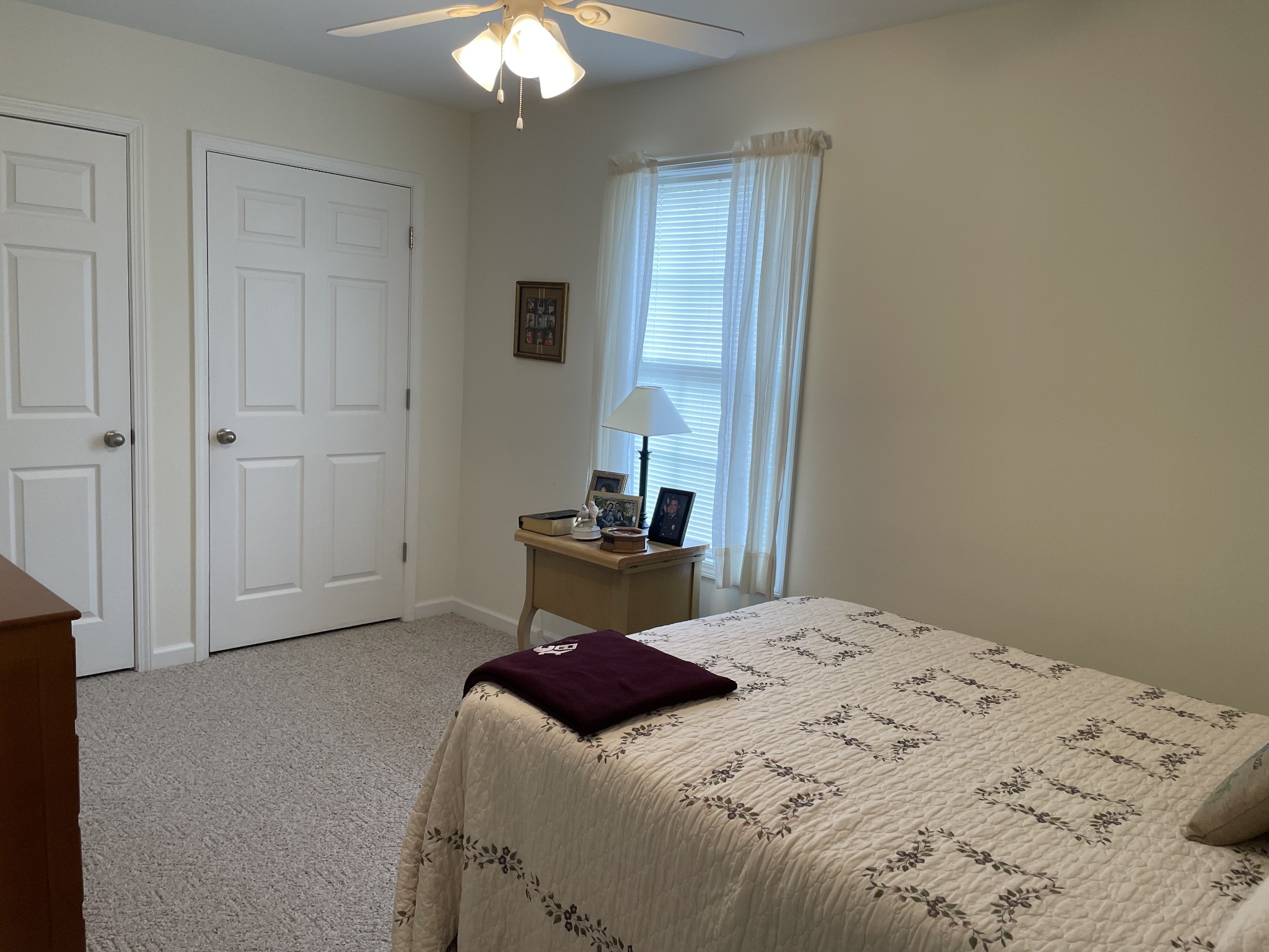 301 Rosson Street Summertown, TN 38483 - Photo 23 of 29 a bedroom with a bed and a lamp