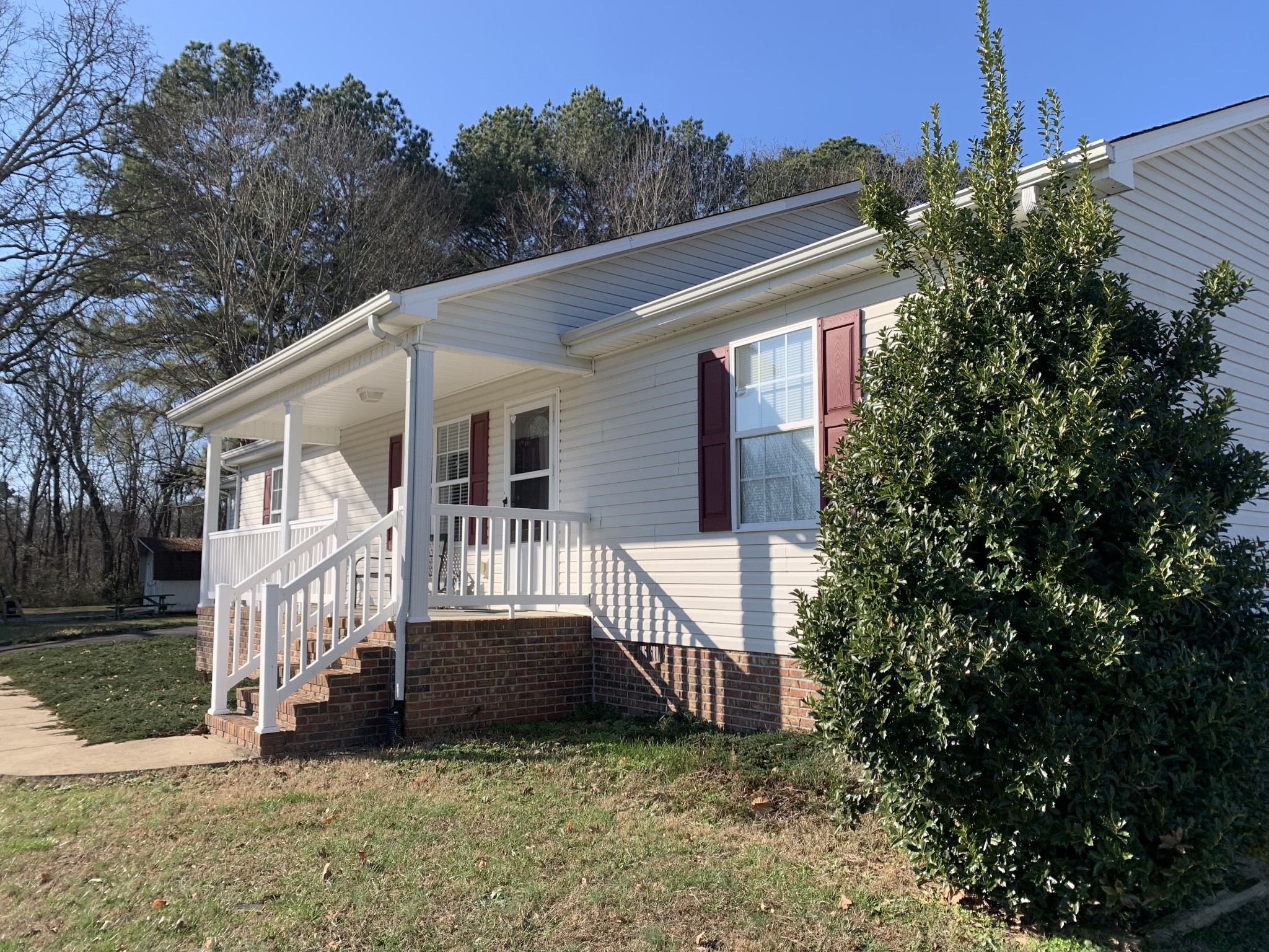 301 Rosson Street Summertown, TN 38483 - Photo 5 of 29 a view of a house with a small yard and a large tree