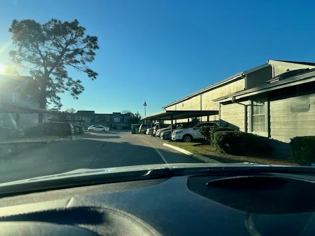 a view of a car parked on the side of the road