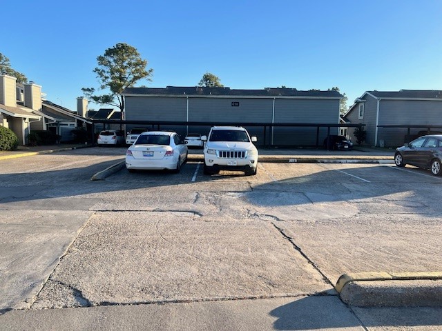 12245 Lemon Ridge Lane, Unit 122 Houston, TX 77035 - Photo 13 of 26 a car parked on the side of a street