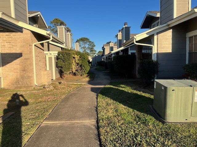 12245 Lemon Ridge Lane, Unit 122 Houston, TX 77035 - Photo 14 of 26 a front view of a house with a yard