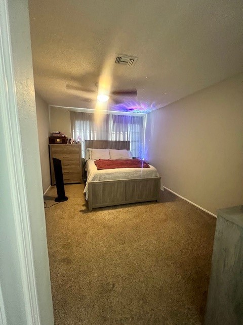 12245 Lemon Ridge Lane, Unit 122 Houston, TX 77035 - Photo 24 of 26 a living room with a bed furniture and a fireplace