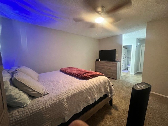 12245 Lemon Ridge Lane, Unit 122 Houston, TX 77035 - Photo 25 of 26 a bedroom with a bed and a television