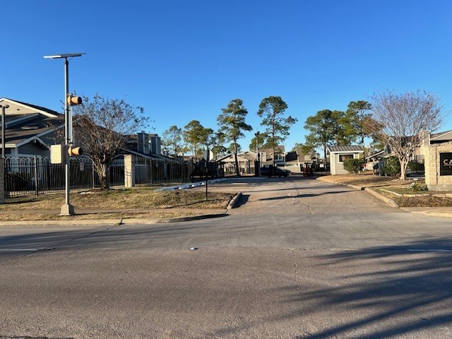 12245 Lemon Ridge Lane, Unit 122 Houston, TX 77035 - Photo 4 of 26 a view of street with cars